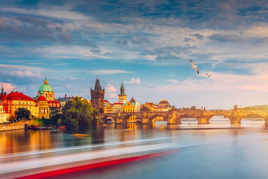 Prague Castle, Charles Bridge and boats on the Vltava river. View of Hradcany Prague Castle, Charles Bridge and a boats on the Vltava river in the capital of the Czechia. Boat cruise on Vltava river.