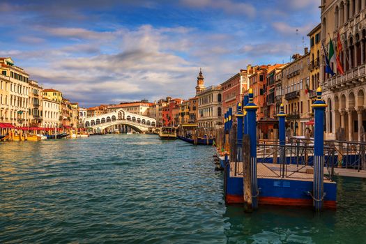 Rialto bridge in Venice, Italy. Venice Grand Canal. Architecture and landmarks of Venice. Venice postcard with Venice gondolas