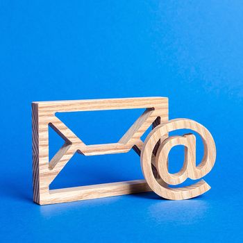 Envelope and email symbol on a blue background. Concept email address. Internet technologies and contacts for communication. Communication over the network, business and correspondence.