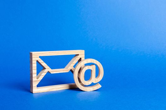 Envelope and email symbol on a blue background. Concept email address. Internet technologies and contacts for communication. Communication over the network, business and correspondence.