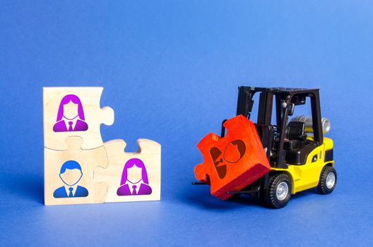A forklift truck carries a red puzzle to the unfinished assembly of business team. Search, recruitment staff, hiring leader. Creating an efficient and productive business unit. Leadership and teamwork