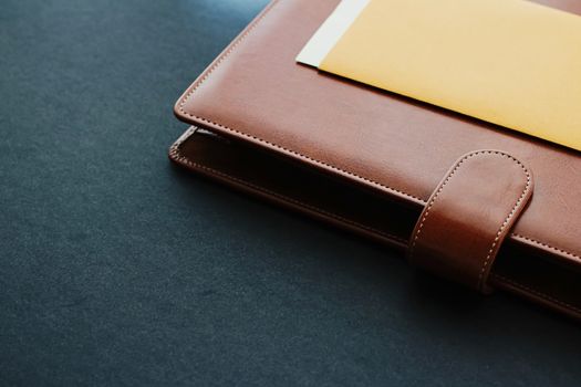 Office desk with briefcase and business card, finance and economy concept