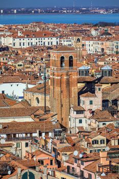 Venice panoramic aerial view with red roofs, Veneto, Italy. Aerial view with dense medieval red roofs of Venice, Italy 