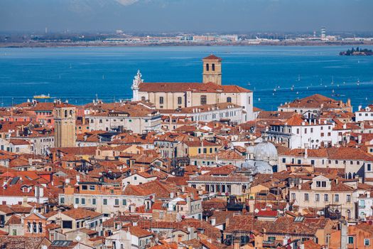 Venice panoramic aerial view with red roofs, Veneto, Italy. Aerial view with dense medieval red roofs of Venice, Italy 