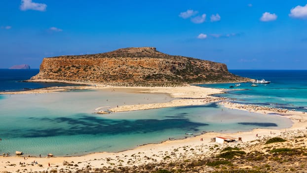 Amazing beach with turquoise water at Balos Lagoon and Gramvousa in Crete, Greece. Cap tigani in the center. Balos beach on Crete island, Greece. Landscape of Balos beach at Crete island in Greece.