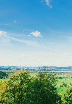 Beautiful nature of European Alps, landscape view of alpine mountains, lake and village in spring season, travel and destination scenery