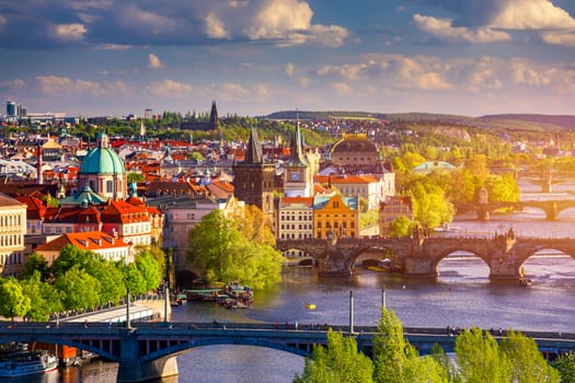 Scenic view of the Old Town pier architecture and Charles Bridge over Vltava river in Prague, Czech Republic. Prague iconic Charles Bridge (Karluv Most) and Old Town Bridge Tower at sunset, Czechia.