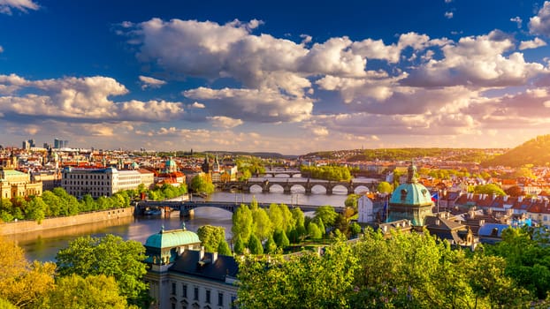 Scenic view of the Old Town pier architecture and Charles Bridge over Vltava river in Prague, Czech Republic. Prague iconic Charles Bridge (Karluv Most) and Old Town Bridge Tower at sunset, Czechia.