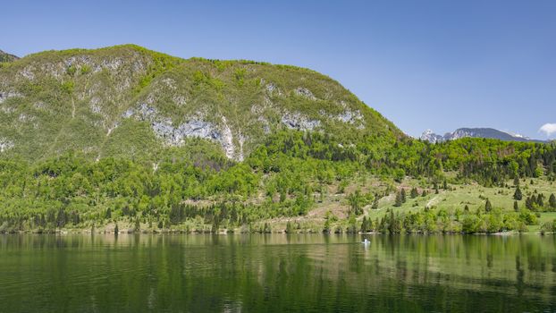 Lake Bohinj in Slovenia, beauty in nature. Colorful summer on the Bohinj lake in Triglav national park Slovenia, Alps, Europe. Mountain Lake bohinj in Julian Alps, Slovenia