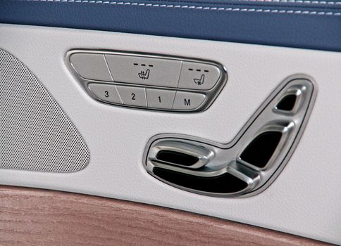 Buttons for adjusting seat position. Car interior detail