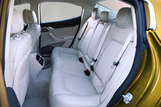 white rear seat of a luxury passenger car