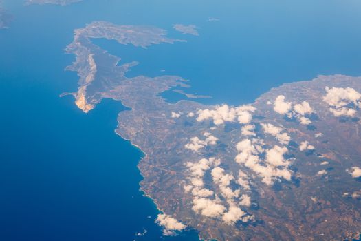View On Adriatic From Plane. Traveling, Holiday, Vacation Concept. View from airplane on Earth surface. Landscape view of islands from the airplane. Greece Islands From Airplane