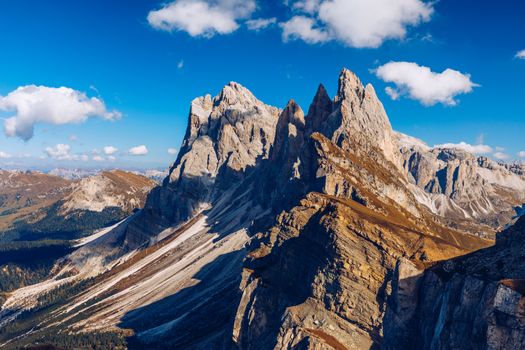 Seceda in autumn in South Tyrol in the Alps of North Italy. Views from Seceda over the Odle mountains in autumn with fall colors. Seceda, Val Gardena, Trentino Alto Adige, South Tyrol in Italy.