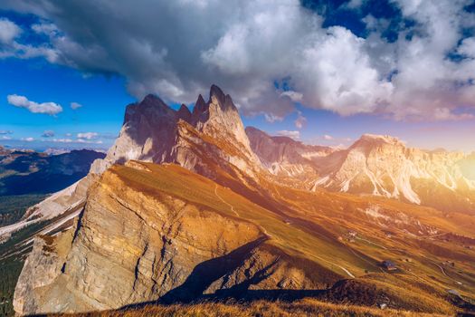 Seceda in autumn in South Tyrol in the Alps of North Italy. Views from Seceda over the Odle mountains in autumn with fall colors. Seceda, Val Gardena, Trentino Alto Adige, South Tyrol in Italy.