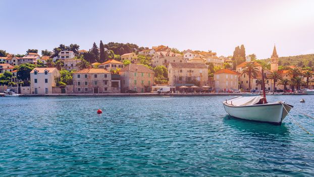 Fishing boats in Splitska village with beautiful port, Brac island, Croatia. Village of Splitska on Brac island seafront view, Dalmatia, Croatia, Croatia.