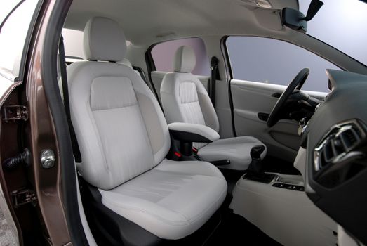 White front seats in a large passenger car