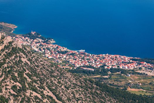 View on mountains and sea from Vidova Gora on Brac island. View from the mountain Vidova Gora on the island Brac in Croatia with the famous landmark Zlatni Rat near the city of Bol an the blue sea.