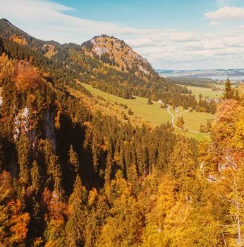 Beautiful nature of European Alps, landscape view of alpine mountains, lake and village in autumn season, travel and destination scenery