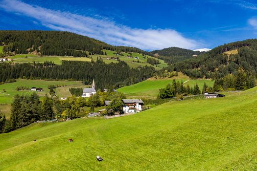 Santa Maddalena (Santa Magdalena) village with magical Dolomites mountains in background, Val di Funes valley, Trentino Alto Adige region, South Tyrol, Italy, Europe. Santa Maddalena Village, Italy. 