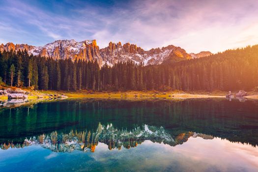 Carezza lake (Lago di Carezza, Karersee) with Mount Latemar, Bolzano province, South tyrol, Italy. Landscape of Lake Carezza or Karersee and Dolomites in background, Nova Levante, Bolzano, Italy.