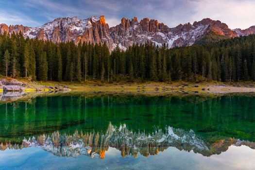 Carezza lake (Lago di Carezza, Karersee) with Mount Latemar, Bolzano province, South tyrol, Italy. Landscape of Lake Carezza or Karersee and Dolomites in background, Nova Levante, Bolzano, Italy.