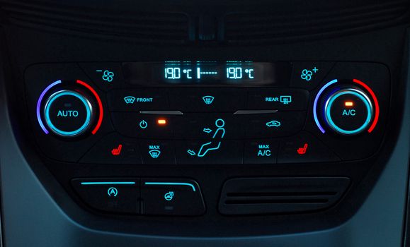 manual switches the air conditioning on the dashboard of the car