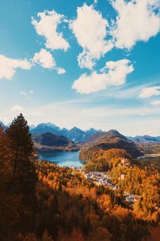 Beautiful nature of European Alps, landscape view of alpine mountains, lake and village in autumn season, travel and destination scenery