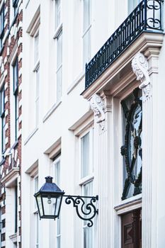 Architectural detail of a building on the main city center street of Amsterdam in Netherlands, european architecture