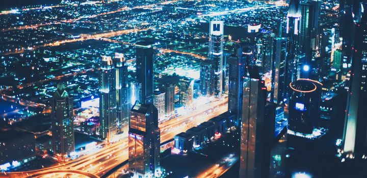 Aerial night view of Dubai in United Arab Emirates, metropolitan cityscape scenery