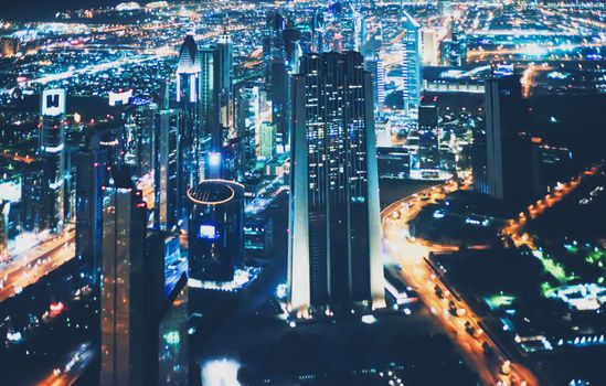 Aerial night view of Dubai in United Arab Emirates, metropolitan cityscape scenery