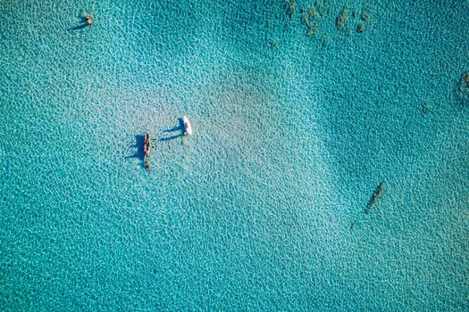 Aerial view of beautiful tropical Elafonissi Beach with pink sand. View of a nice tropical Elafonissi beach from the air. Beautiful sky, sea, resort. Elafonissi beach, Crete, Greece.