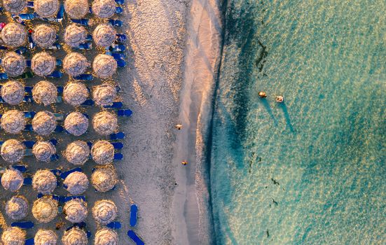 Aerial drone shot of beautiful turquoise beach with pink sand Elafonissi, Crete, Greece. Best beaches of Mediterranean, Elafonissi beach, Crete, Greece. Famous Elafonisi beach on Greece island, Crete.