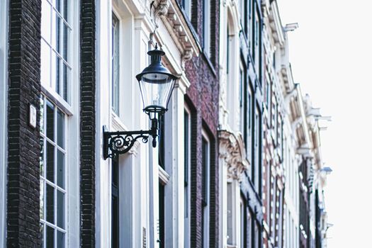 Architectural detail of a building on the main city center street of Amsterdam in Netherlands, european architecture
