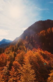 Beautiful nature of European Alps, landscape view of alpine mountains, lake and village in autumn season, travel and destination scenery