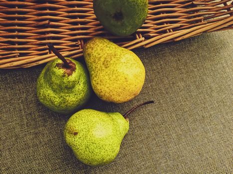 Organic pears on rustic linen background, fruits farming and agriculture