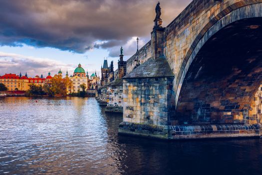 Charles Bridge in Prague in Czechia. Prague, Czech Republic. Charles Bridge (Karluv Most) and Old Town Tower. Vltava River and Charles Bridge. Concept of world travel, sightseeing and tourism.