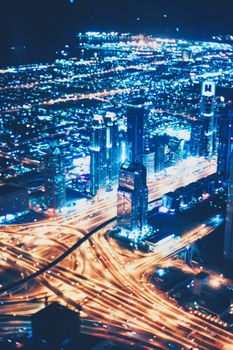 Aerial night view of Dubai in United Arab Emirates, metropolitan cityscape scenery