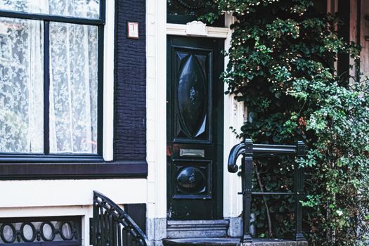 Architectural detail of a building on the main city center street of Amsterdam in Netherlands, european architecture