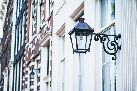 Architectural detail of a building on the main city center street of Amsterdam in Netherlands, european architecture