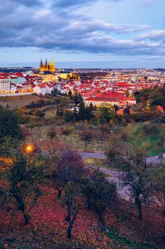 Prague autumn landscape. Prague autumn landscape view to Saint Vitus cathedral. Prague. Prague panorama. Prague, Czech Republic. Scenic autumn aerial view of the Old Town with red foliage. Czechia.