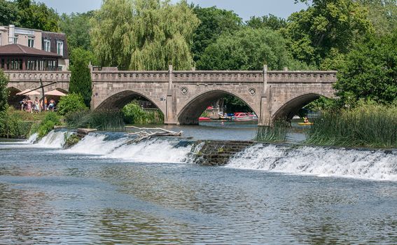 water flowing over weirs at bathampton