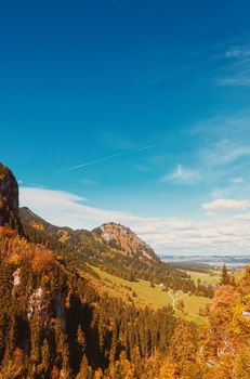 Beautiful nature of European Alps, landscape view of alpine mountains, lake and village in autumn season, travel and destination scenery