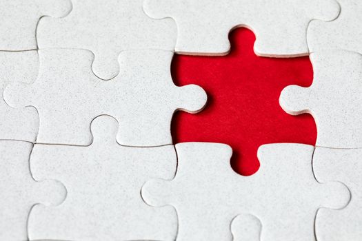 Jigsaw puzzle with missing piece. Missing puzzle pieces. Concept image of unfinished task. Completing final task, missing jigsaw puzzle pieces and business concept with a puzzle piece missing.