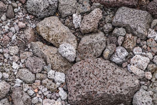 Leilani Estate, Hawaii, USA. - January 14, 2020: 2018 Kilauea volcano eruption hardened black lava field. Closeup of porous rocks and pebbles.