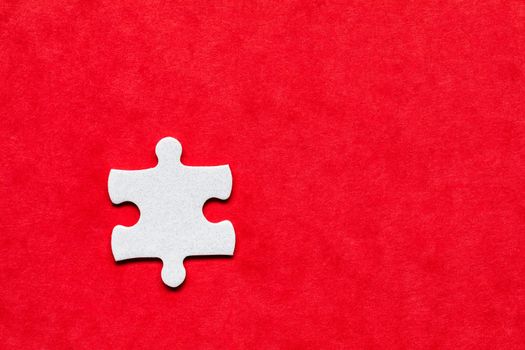 White jigsaw puzzle. White puzzle pieces on color background. Unfinished white jigsaw puzzle pieces on color background. 