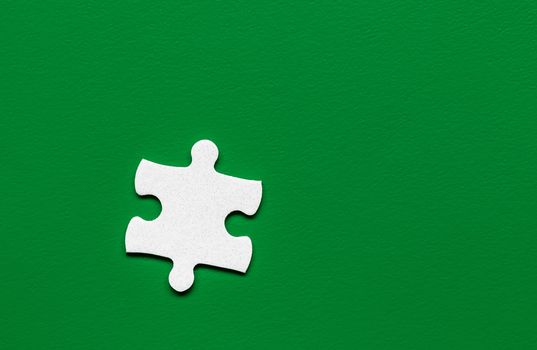 White jigsaw puzzle. White puzzle pieces on color background. Unfinished white jigsaw puzzle pieces on color background. 
