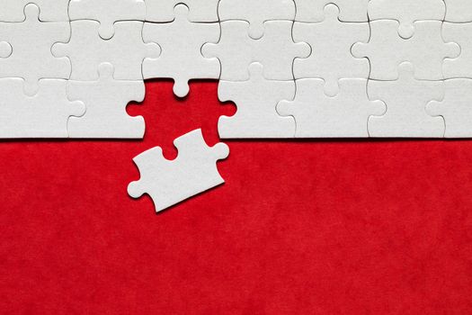 Closeup of jigsaw puzzle isolated. Missing jigsaw puzzle piece, business concept for completing the puzzle piece. Group of puzzle and a puzzle piece. Teamwork concept. Think difference concept. 