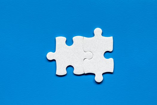 Closeup of jigsaw puzzle isolated. Missing jigsaw puzzle piece, business concept for completing the puzzle piece. Group of puzzle and a puzzle piece. Teamwork concept. Think difference concept. 