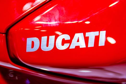 Nonthaburi Thailand:- December 8, 2017:  Closeup - Logo "DUCATI" Red Motorcycle Ducati Monster at International Motor Show 2017 - Nonthaburi, Thailand