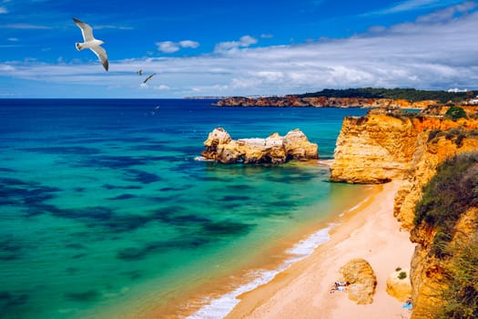 Praia dos Tres Castelos in south Portugal, Portimao, Algarve region. Landscape with Atlantic Ocean, shore and rocks in Tres Castelos beach (Praia dos Tres Castelos), Algarve, Portimao, Portugal.